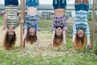 Создать мем Four-young-girls-hanging-upside-down-in-park