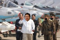 Создать мем Kim Jong Elbegdorj in North Korean airfield