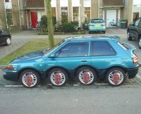 Создать мем Kim Jong Un head on car wheels
