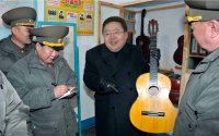  kim jong un's mongolian handyman, Мем Tsakhiagiin Elbegdorj with a guitar in military unit