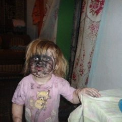 Девочка с чёрным лицом