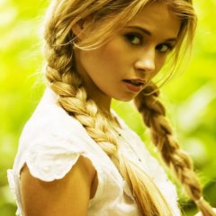 Beautiful eyes of a girl and a scythe