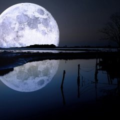 The moon above the sky and the sea