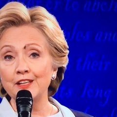 On the forehead of Hillary Clinton- a fly has landed