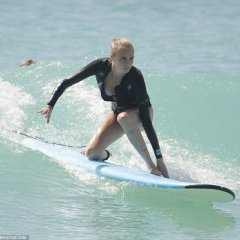 Cara Delevingne - Surfboard