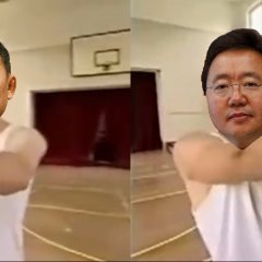 Battulga and Elbegdorj holding the ball in Thatll Teach Em