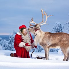 Santa Elbegdorj handling a reindeer