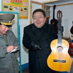 Tsakhiagiin Elbegdorj with a guitar in military unit